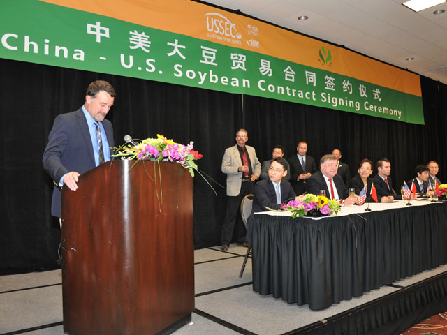 Cutline: U.S. grain companies sit down with Chinese soybean buyers for a signing ceremony in 2014. (DTN photo by Katie Micik)